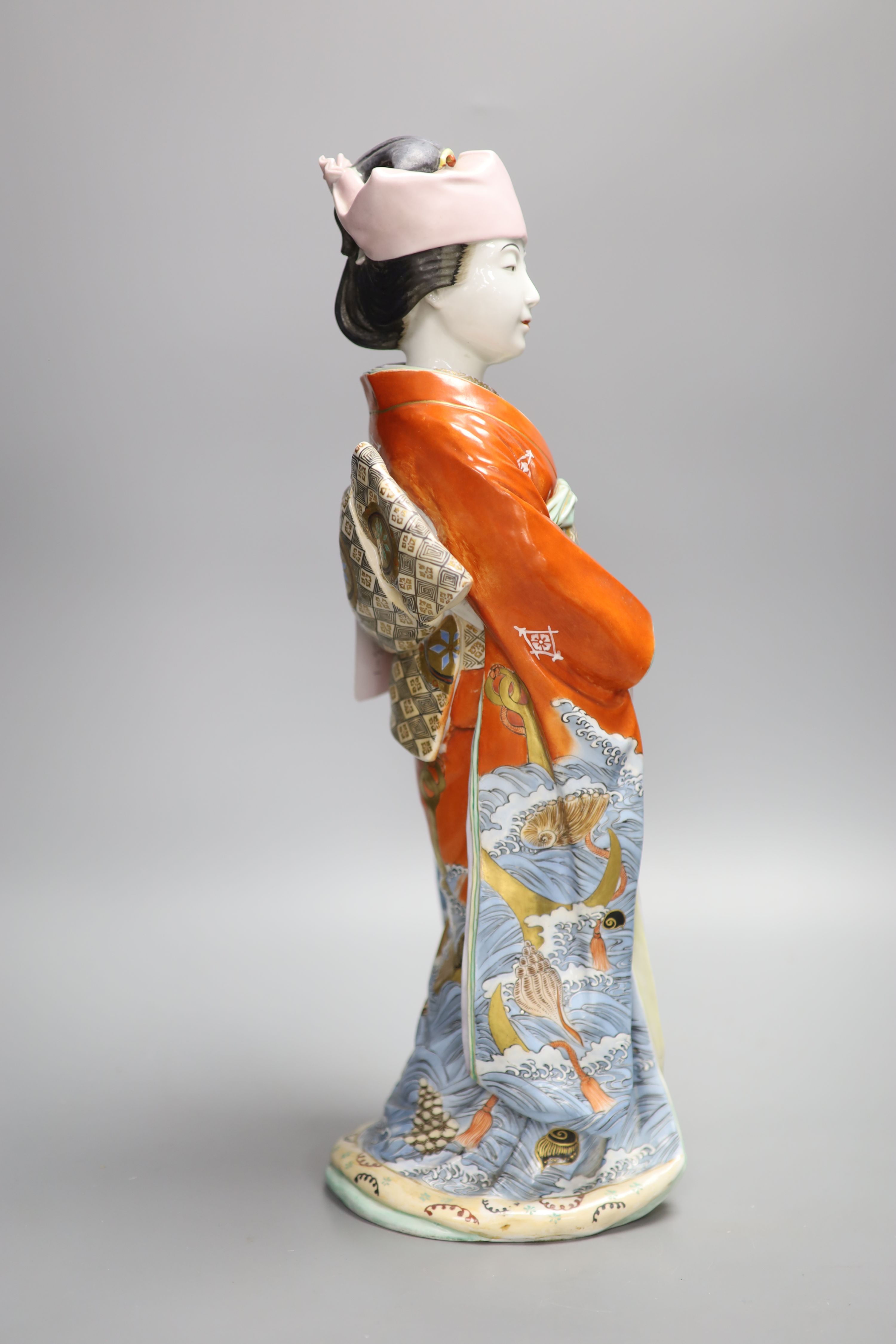 A large Japanese enamelled porcelain figure of a Geisha, early 20th century, height 46cm